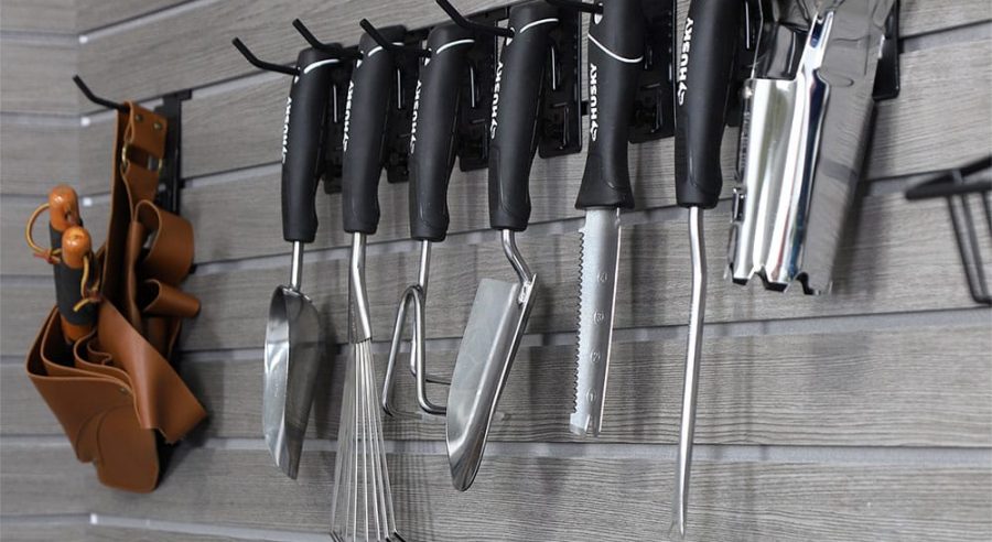 Organized gardening tools and supplies on MKE Slatwall panels in a garage