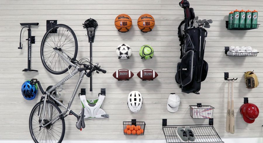 Organized garage with slatwall panels showcasing efficient use of vertical storage space.